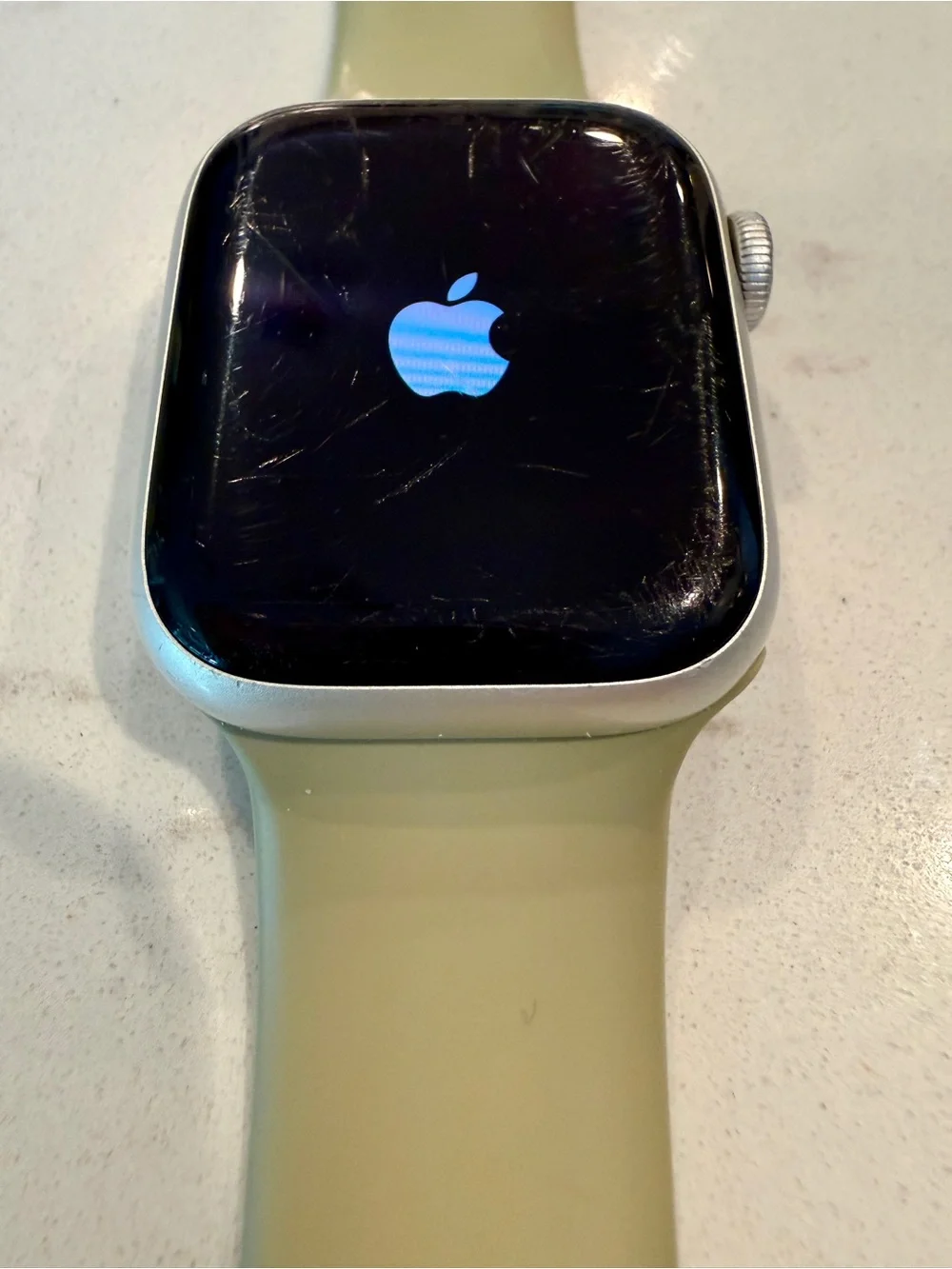 Apple Watch Series 7, 41mm with neutral Sport Band and Silver Aluminum Case